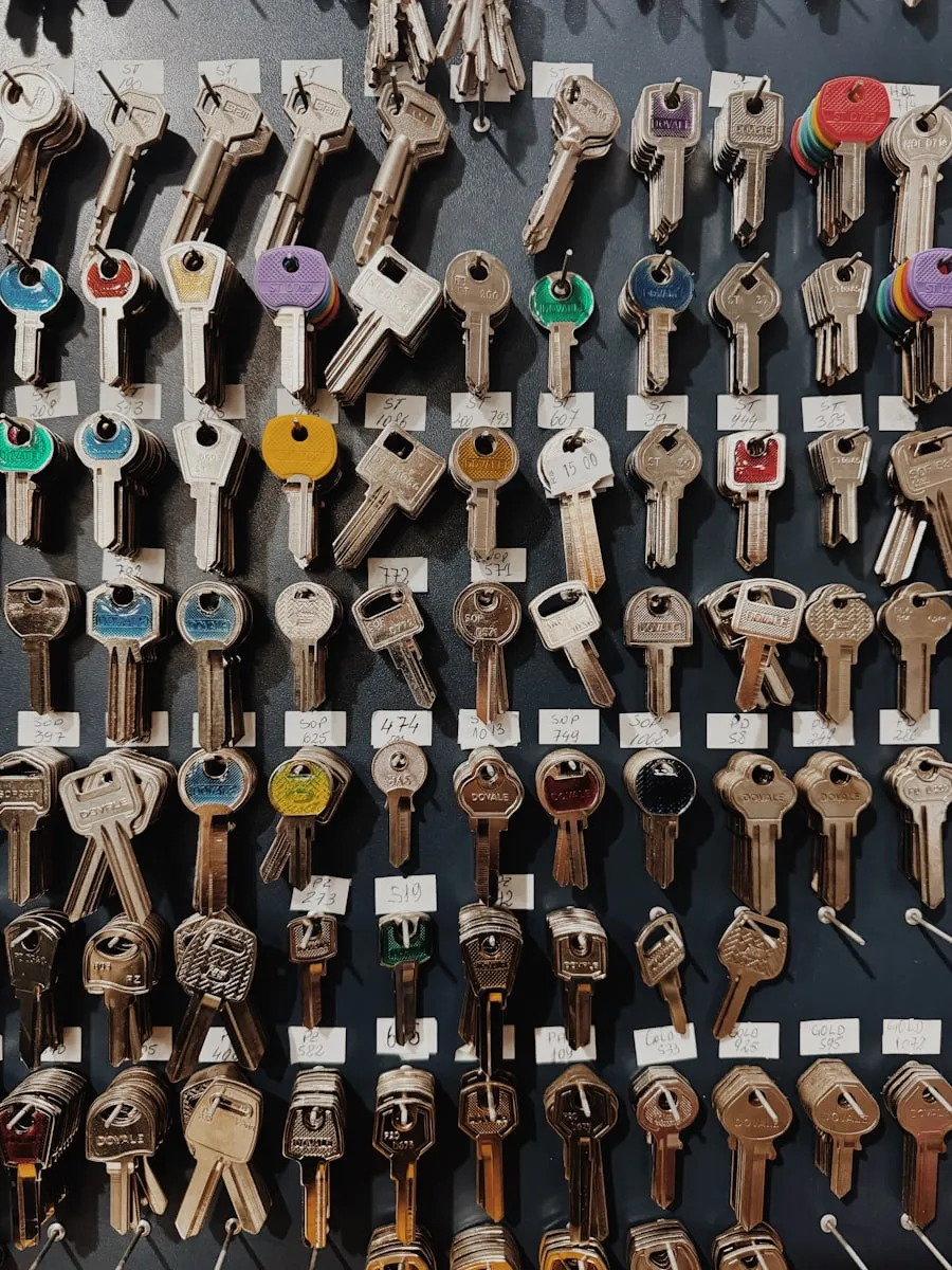 A wall of tagged key blanks in the MetroKey workshop.