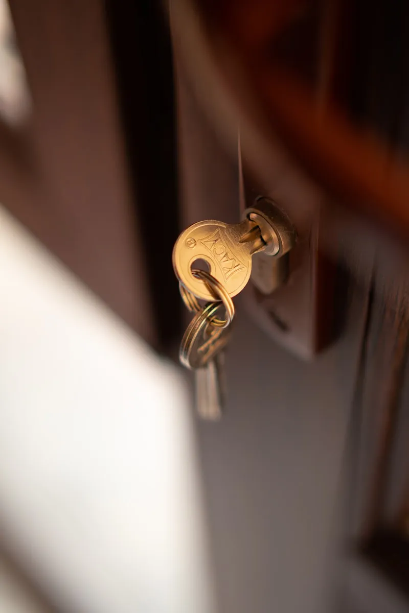 A key turning in a front door cylinder lock.
